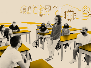 A teacher is in the middle of the classroom, in dialogue with students who are seated at their desks around her.